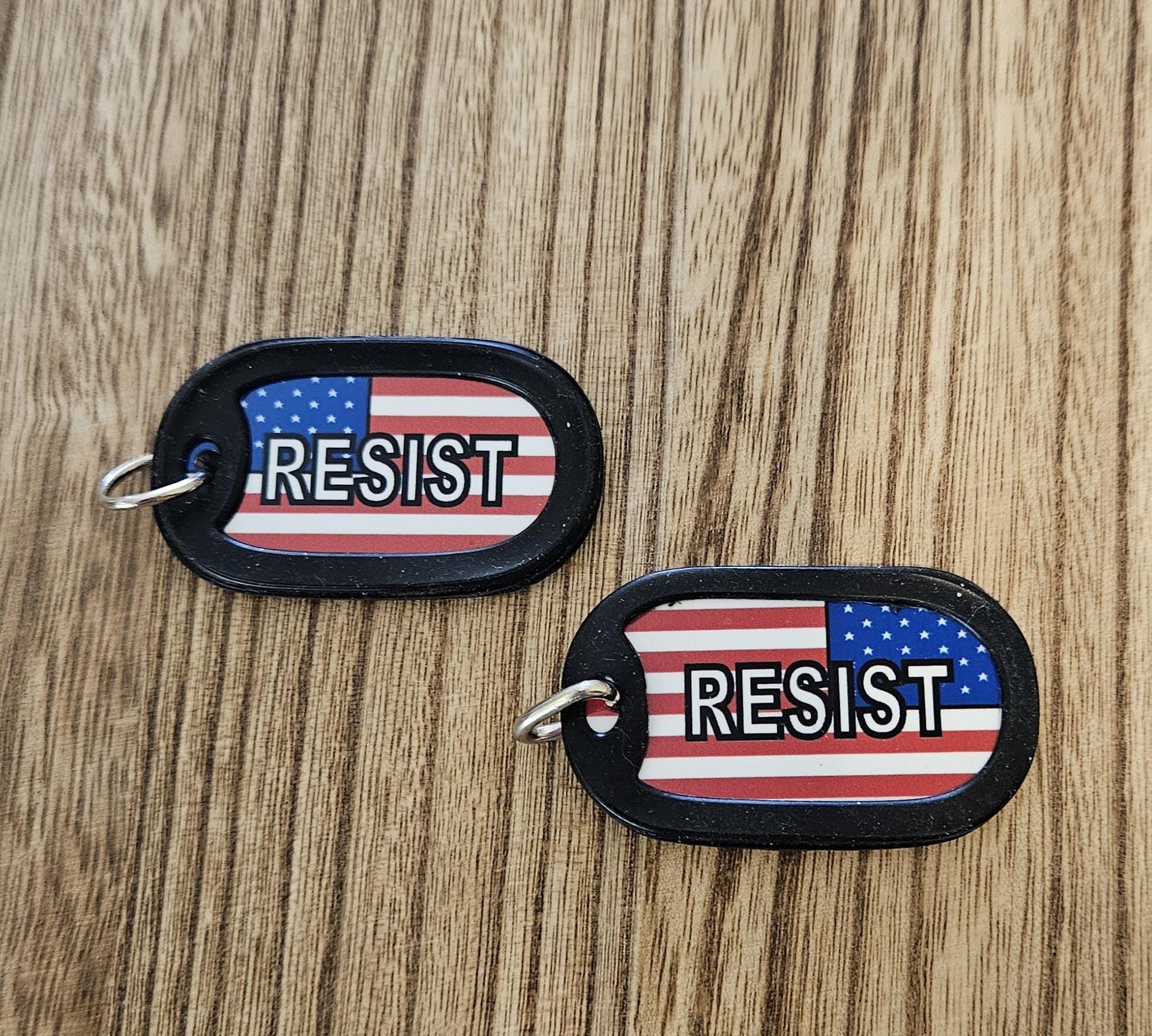 US Flag with RESIST (black outline white letters) with regular US Flag or in distress upside down flag