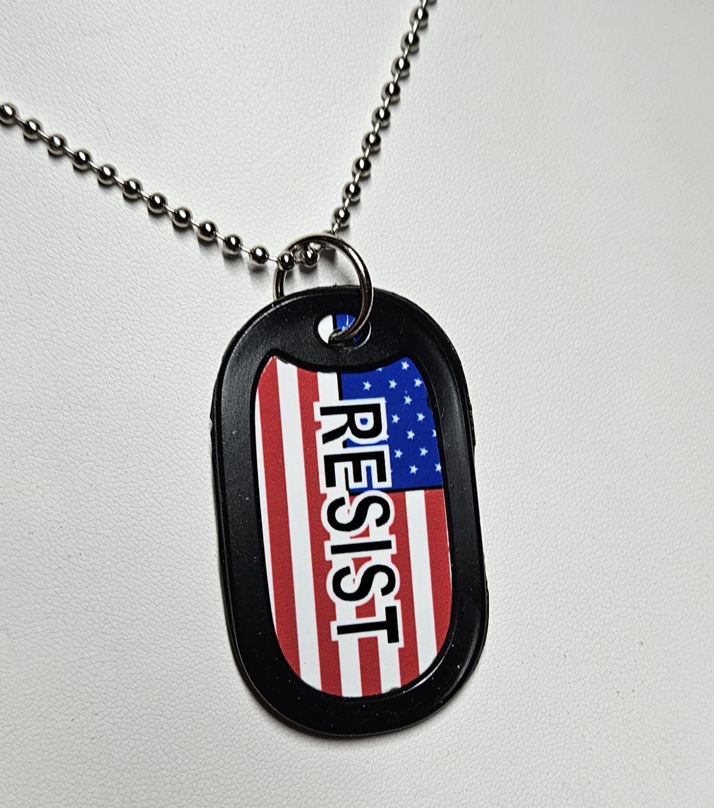 US Flag with RESIST (white outline black letters) avail in regular US Flag or in distress upside down flag